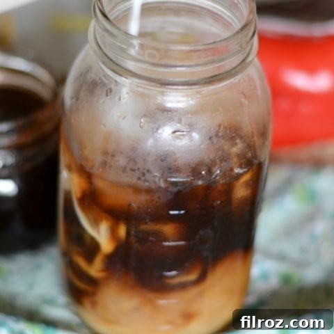 A beautiful glass of homemade spiced cold brew coffee with ice and milk