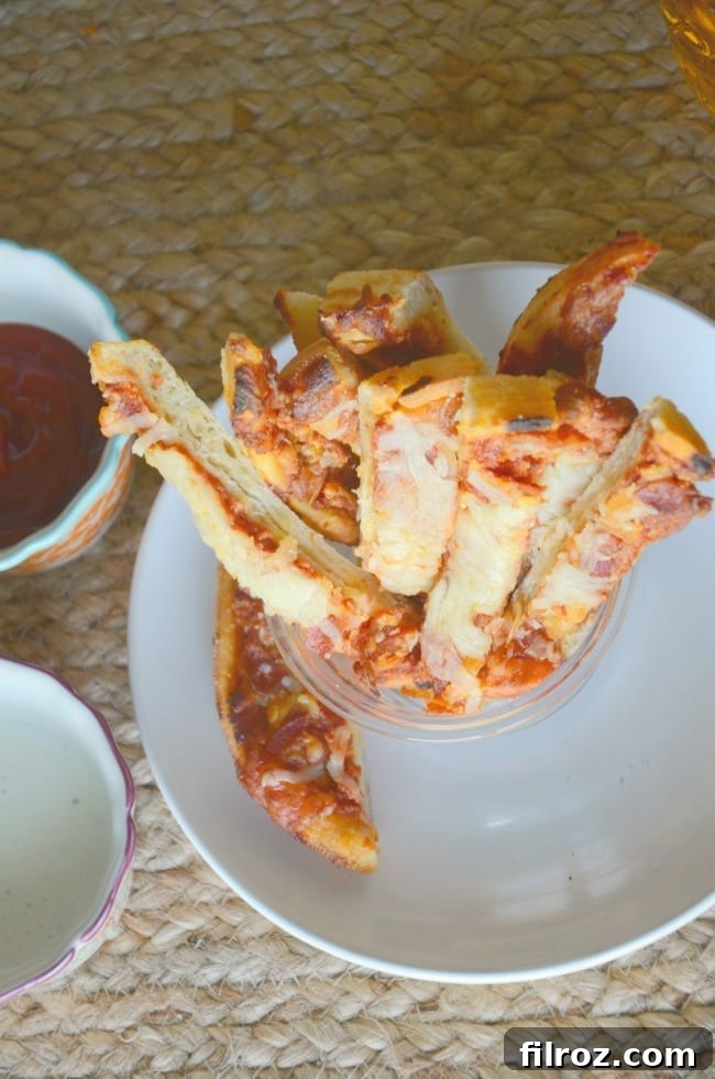 Family enjoying game day snacks on the couch, focused on football