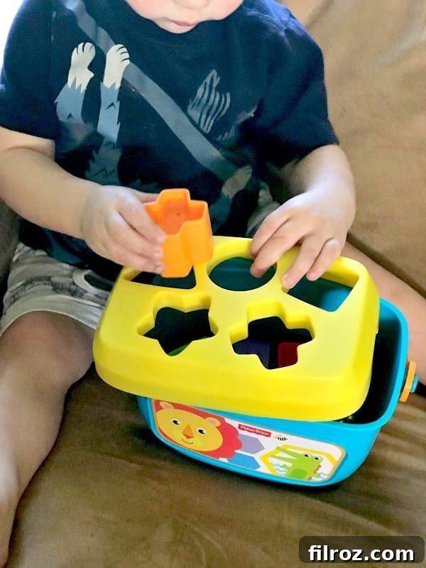 Close-up of a toddler's hands playing with blocks