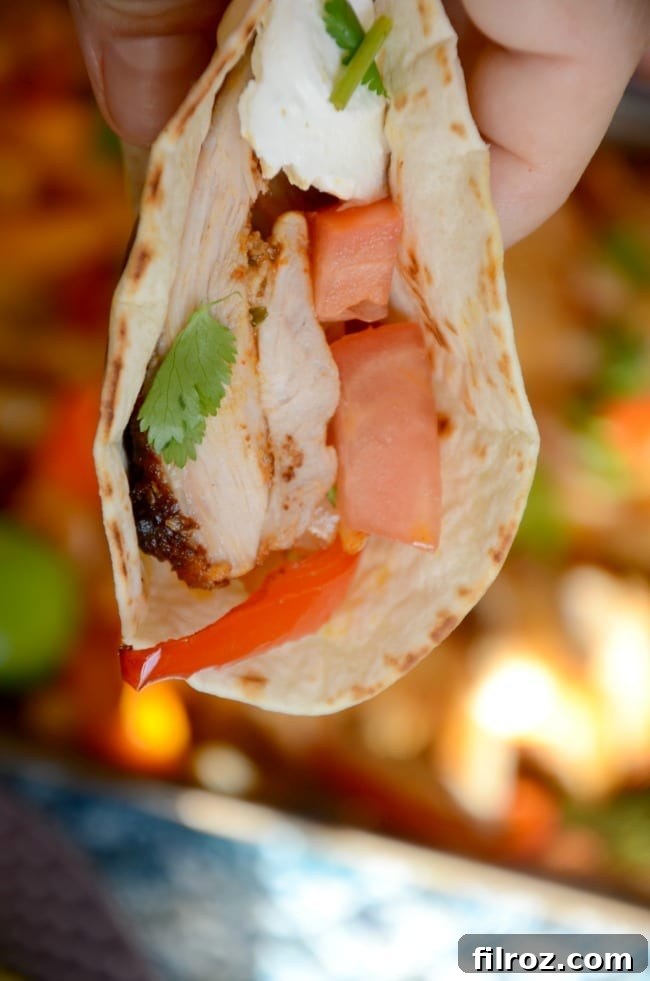 Cooked sheet pan chicken fajitas with lime and cilantro