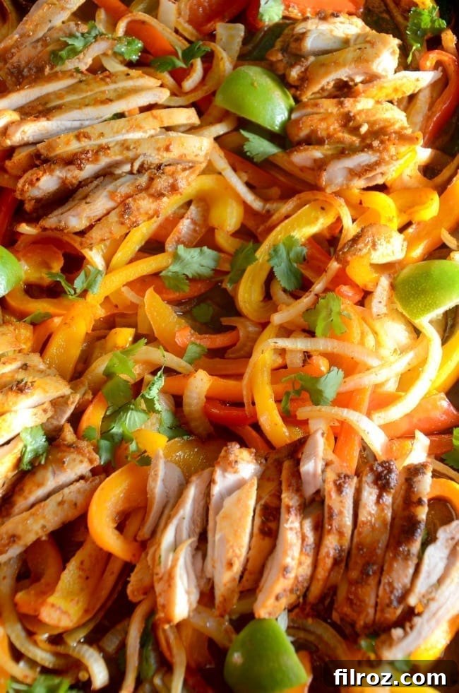 Sheet pan chicken fajitas with various toppings and sides