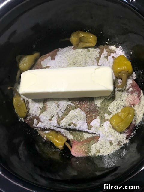 How to make original Mississippi roast in the crock pot: seasoning the roast in the slow cooker.
