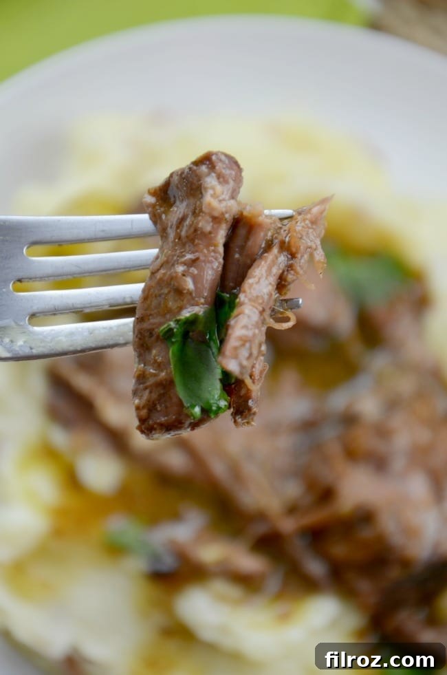 Original Mississippi Pot Roast recipe, a close-up of the shredded beef with its rich sauce.