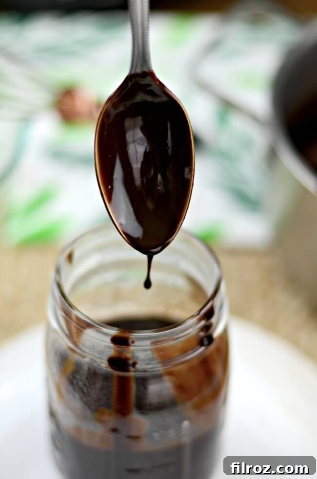 Rich chocolate sauce with cocoa powder in a bowl