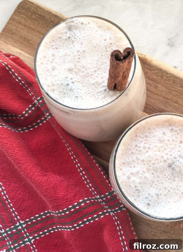 Wholesome Homemade Horchata 2 A refreshing glass of healthy horchata garnished with a cinnamon stick.