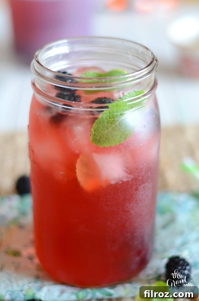 Wholesome Homemade Horchata 8 A pitcher and glasses of refreshing blueberry mint agua fresca.