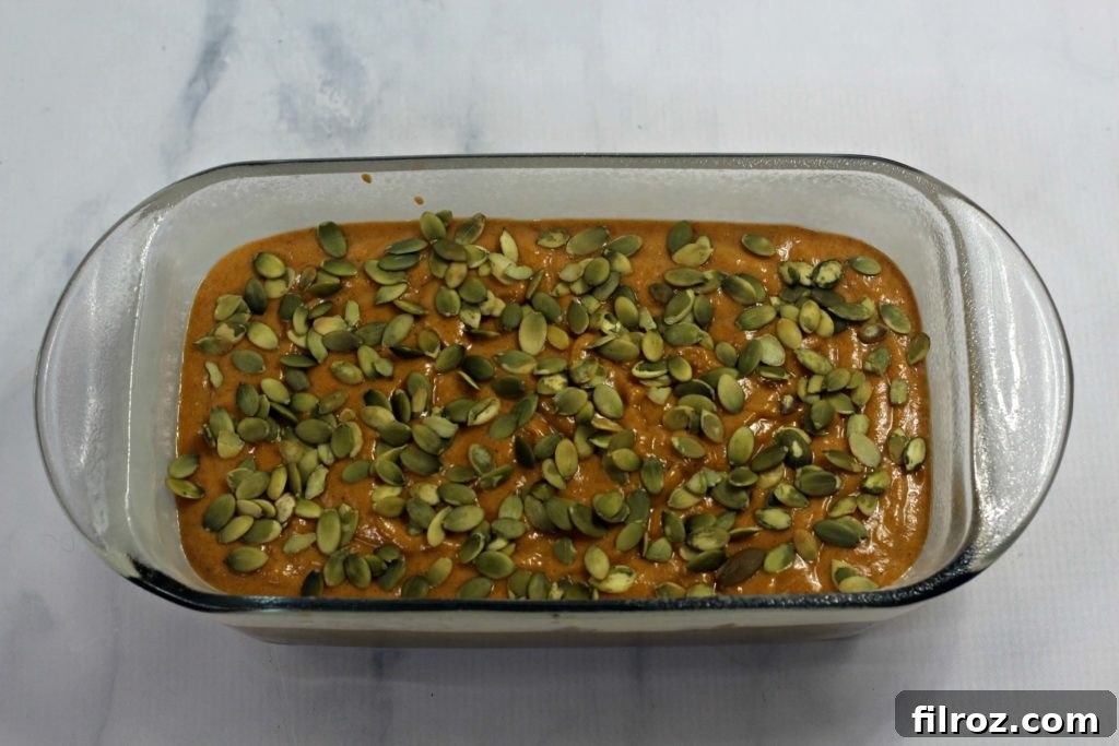 Carefully combining dry and wet ingredients for the pumpkin bread batter