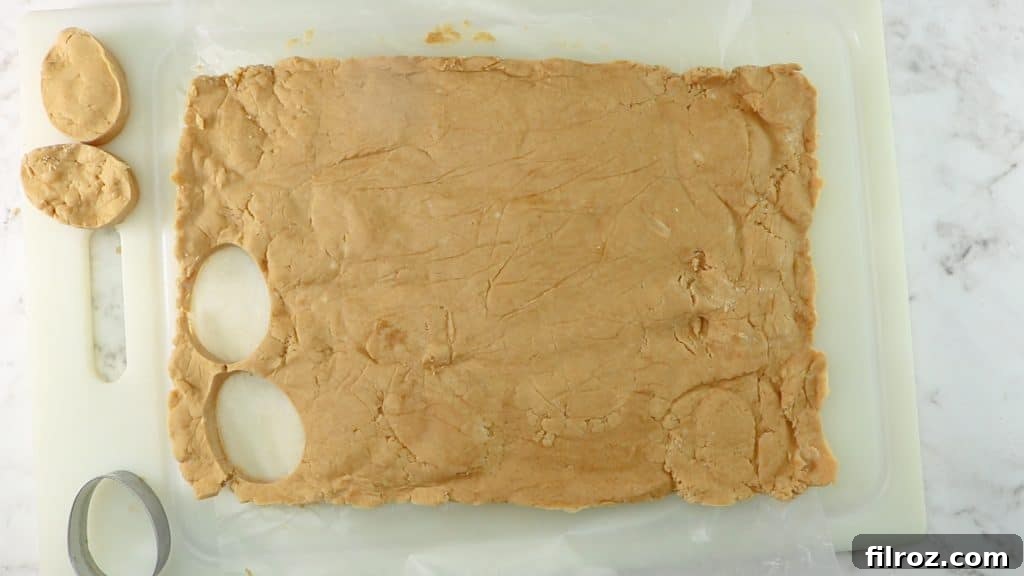 Peanut butter eggs placed on a tray for final freezing