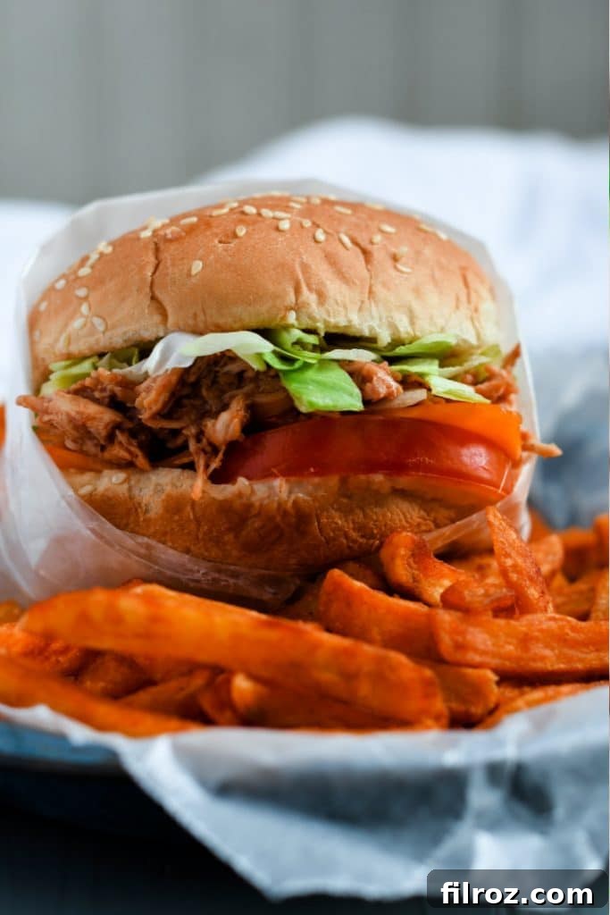 Sweet and Smoky BBQ Chicken Sandwich 4 Plated BBQ chicken sandwiches with toppings