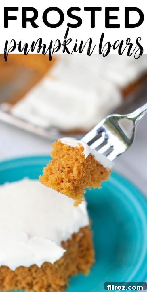 Spiced Pumpkin Bars with Cream Cheese Frosting 15 Close-up of pumpkin bar with cream cheese frosting, ready for sharing