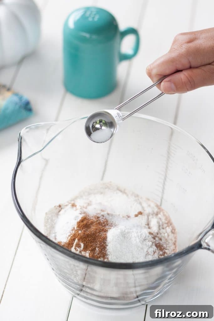 Spiced Pumpkin Bars with Cream Cheese Frosting 5 Mixing eggs and sugar for pumpkin bars