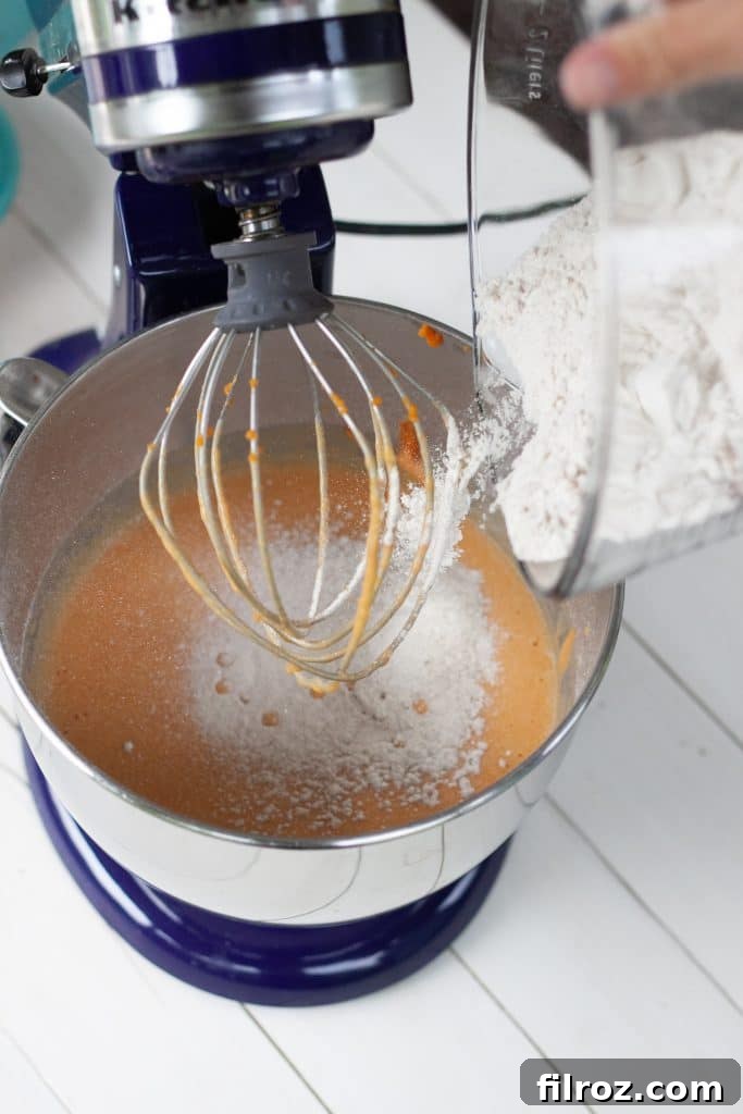 Spiced Pumpkin Bars with Cream Cheese Frosting 7 Sifting dry ingredients for pumpkin bar batter