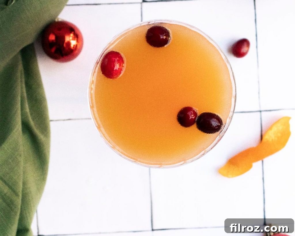 Close-up of an easy Cranberry Orange Mimosa in a flute glass