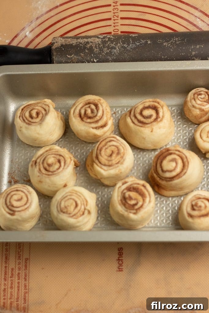 How to make homemade maple cinnamon rolls from scratch, showing baked rolls