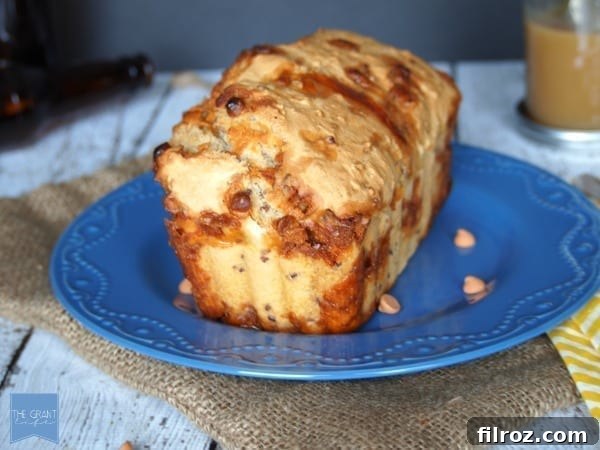 Sliced butterscotch pecan beer bread with a rich, moist texture