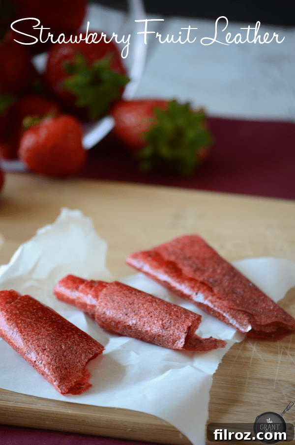Homemade Strawberry Fruit Leather drying on a rack.